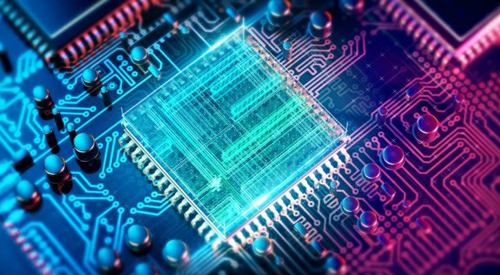 A digital rendering of a circuit board and digital chip in neon colors to illustrate quantum computing