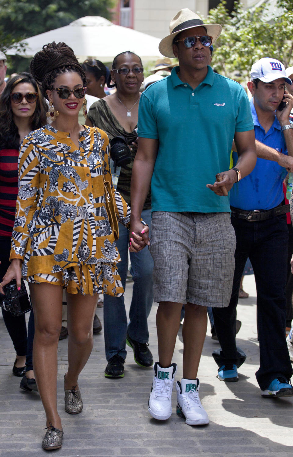 U.S. singer Beyonce and her husband, rapper Jay-Z, hold hands as they tour Old Havana, Cuba, Thursday, April 4, 2013. R&B's power couple is in Havana on their fifth wedding anniversary. (AP Photo/Ramon Espinosa)