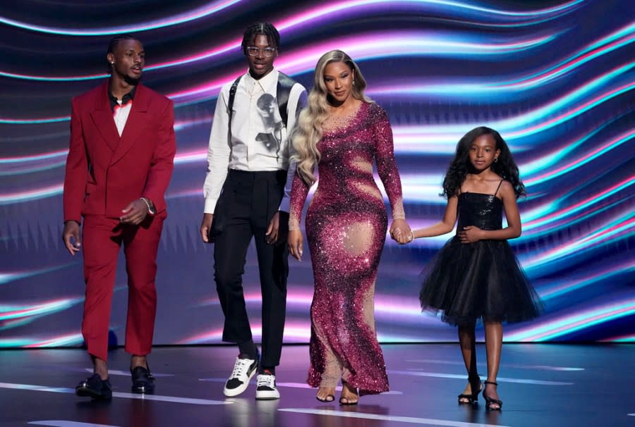 Bronny James, from left, Bryce James, Savannah James, and Zhuri James presents the award for best record-breaking performance at the ESPY awards on Wednesday, July 12, 2023, at the Dolby Theatre in Los Angeles. (AP Photo/Mark Terrill)