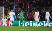 <p>PSG players look dejected as Sergi Roberto of Barcelona scores their sixth goal during the UEFA Champions League Round of 16 second leg match between FC Barcelona and Paris Saint-Germain at Camp Nou on March 8, 2017 in Barcelona, Spain. (Photo by Michael Regan/Getty Images) </p>