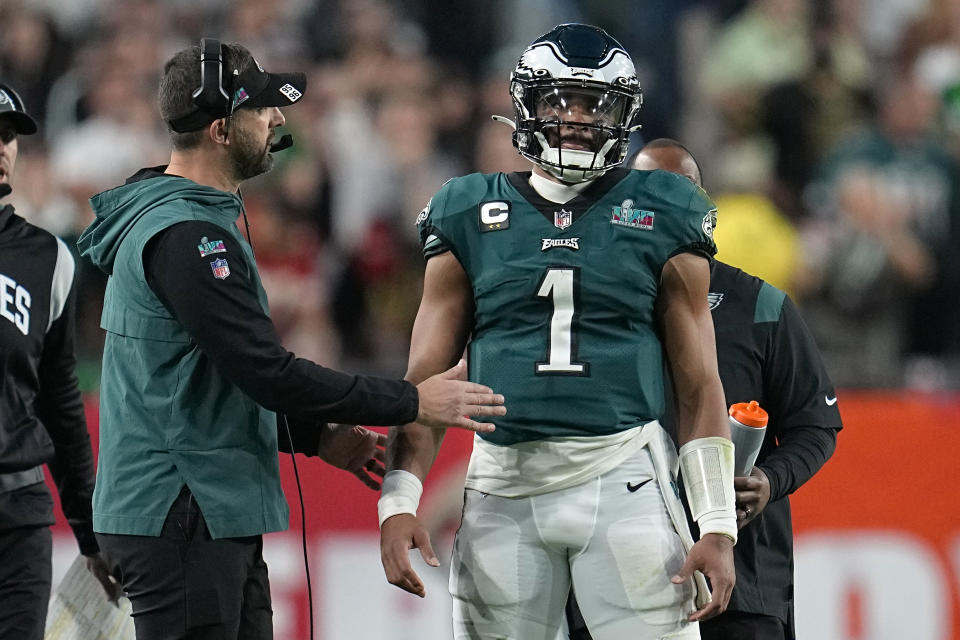 Philadelphia Eagles head coach Nick Sirianni, left, talks with quarterback Jalen Hurts (1) during the first half of the NFL Super Bowl 57 football game against the Kansas City Chiefs, Sunday, Feb. 12, 2023, in Phoenix. (AP Photo/Abbie Parr)