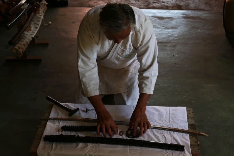Samurai Suemitsu prepares a katana sword at his home in Curitiba