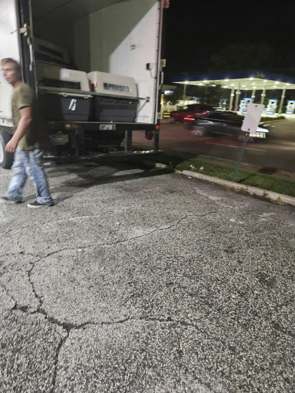 This photo provided by the Humane Society of Hobart, Ind., shows a cargo van, in Lake Station, Ind., in which dogs were being transported from Chicago's O'Hare International Airport to a K-9 training facility in Michigan City, Ind., Thursday, July 27, 2023. (Jennifer Webber/Humane Society of Hobart, Ind. via AP)