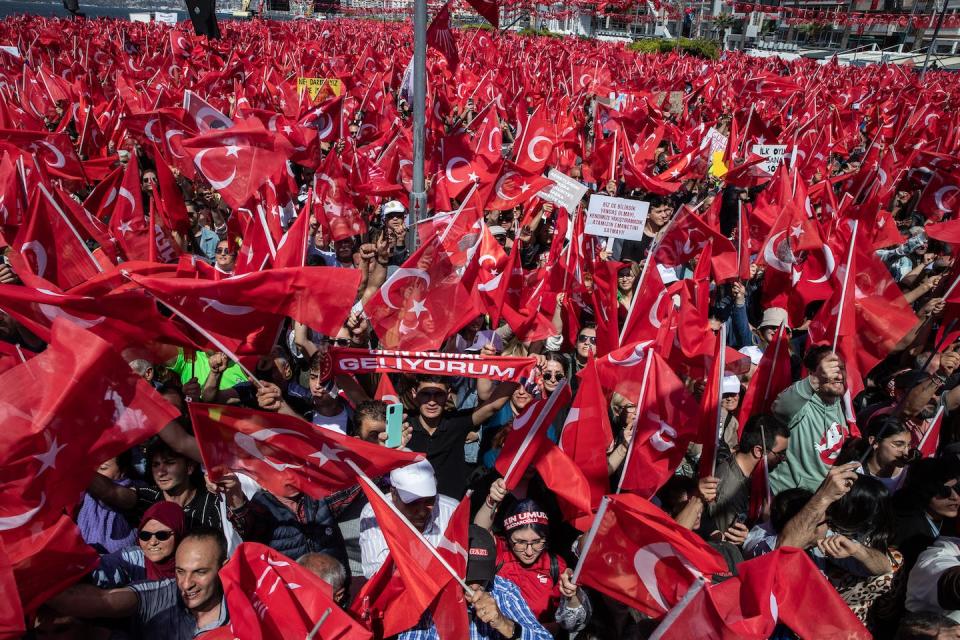 Supporters wave flags and chant slogans while waiting for CHP Party presidential candidate Kemal Kılıçdaroğlu to arrive at a campaign rally on April 30, 2023, in Izmir, Turkey. <a href="https://www.gettyimages.com/detail/news-photo/supporters-wave-flags-and-chant-slogans-while-waiting-for-news-photo/1486600794?adppopup=true" rel="nofollow noopener" target="_blank" data-ylk="slk:Burak Kara/Getty Images;elm:context_link;itc:0;sec:content-canvas" class="link ">Burak Kara/Getty Images</a>