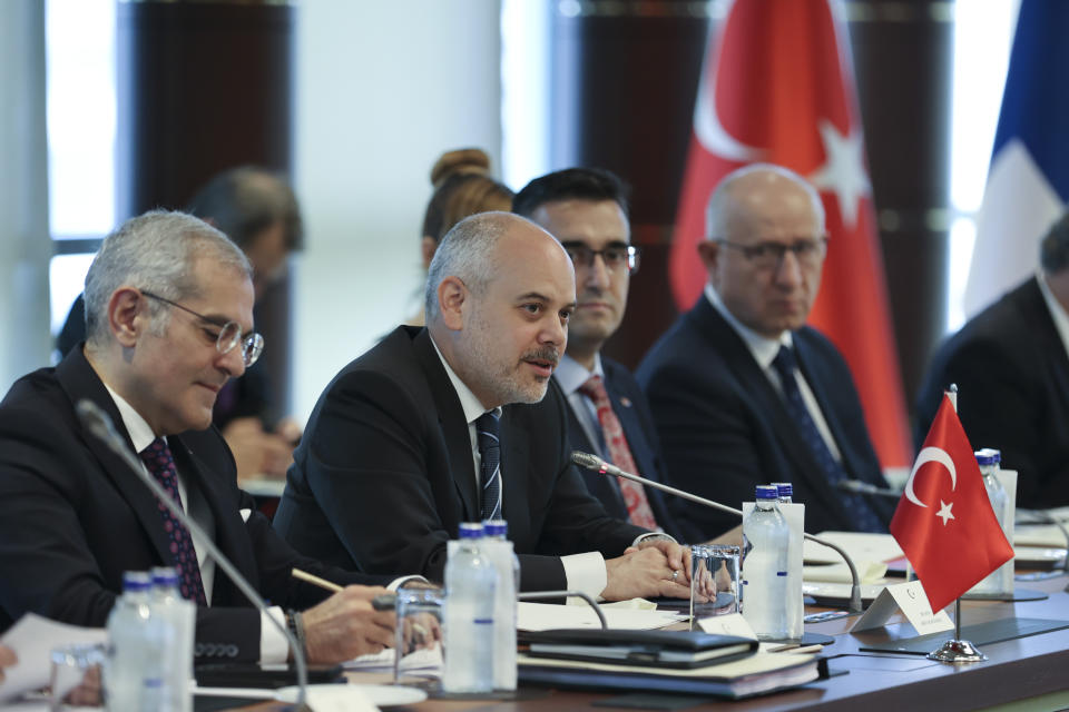In this handout photo released by Turkish Presidency, head of the Turkish delegation ambassador Akif Cagatay Kilic, center, talks during a meeting with other delegations of Sweden, Finland and NATO at Turkish Presidential complex in Ankara, Turkey, Wednesday, June 14, 2023. Senior officials from NATO, Sweden, Finland and Turkey met in Ankara on Wednesday, Turkish media reports said, as the alliance is pressing Turkey to move ahead with the ratification of Sweden's application to join the military bloc. (Ahmet Okur/Turkish Presidency via AP)