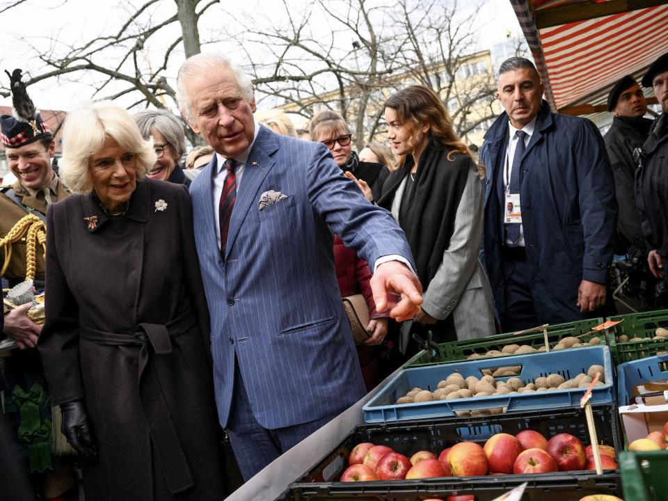 King Charles and Camilla, the Queen Consort, visit a farmer's market on Wittenbergplatz square in Berlin on March 30, 2023.