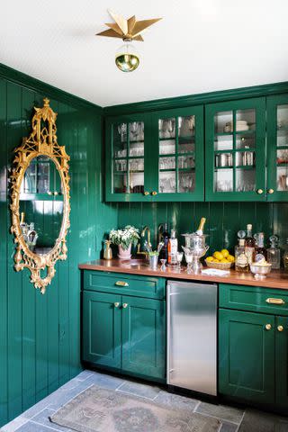 Marta PÃ©rez; Styling: Vero Designs Interior designer Elly Poston Cooper lacquered the walls and cabinetry in this Charleston, South Carolina, bar in a rich emerald green.