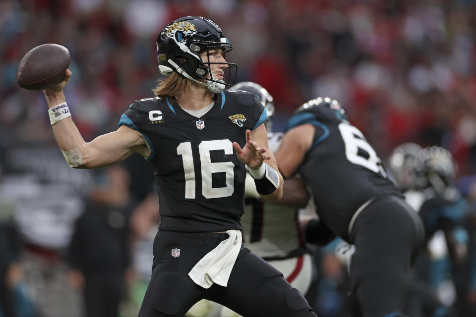 Jacksonville Jaguars quarterback Trevor Lawrence (16) passes the ball during the fourth quarter of an NFL football game against Atlanta Falcons at Wembley stadium in London, Sunday, Oct. 1, 2023. (AP Photo/Ian Walton)