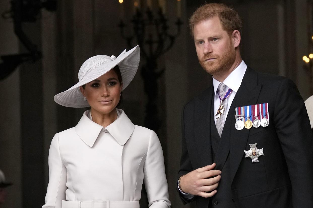 Prince Harry and Meghan, Duchess of Sussex, leave after a service of thanksgiving for the reign of Queen Elizabeth II at St Paul's Cathedral in London, Friday, June 3, 2022 on the second of four days of celebrations to mark the Platinum Jubilee. 