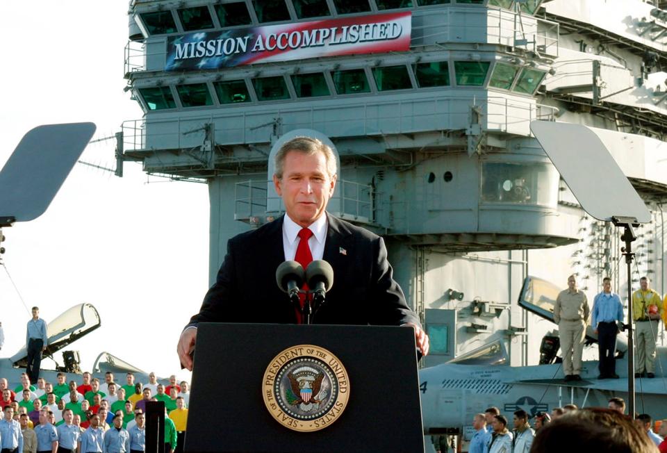 Six weeks after the U.S. invasion, President George W. Bush prematurely declares the end of major combat in Iraq under a "Mission Accomplished" banner on the aircraft carrier USS Abraham Lincoln off the California coast on May 1, 2003.