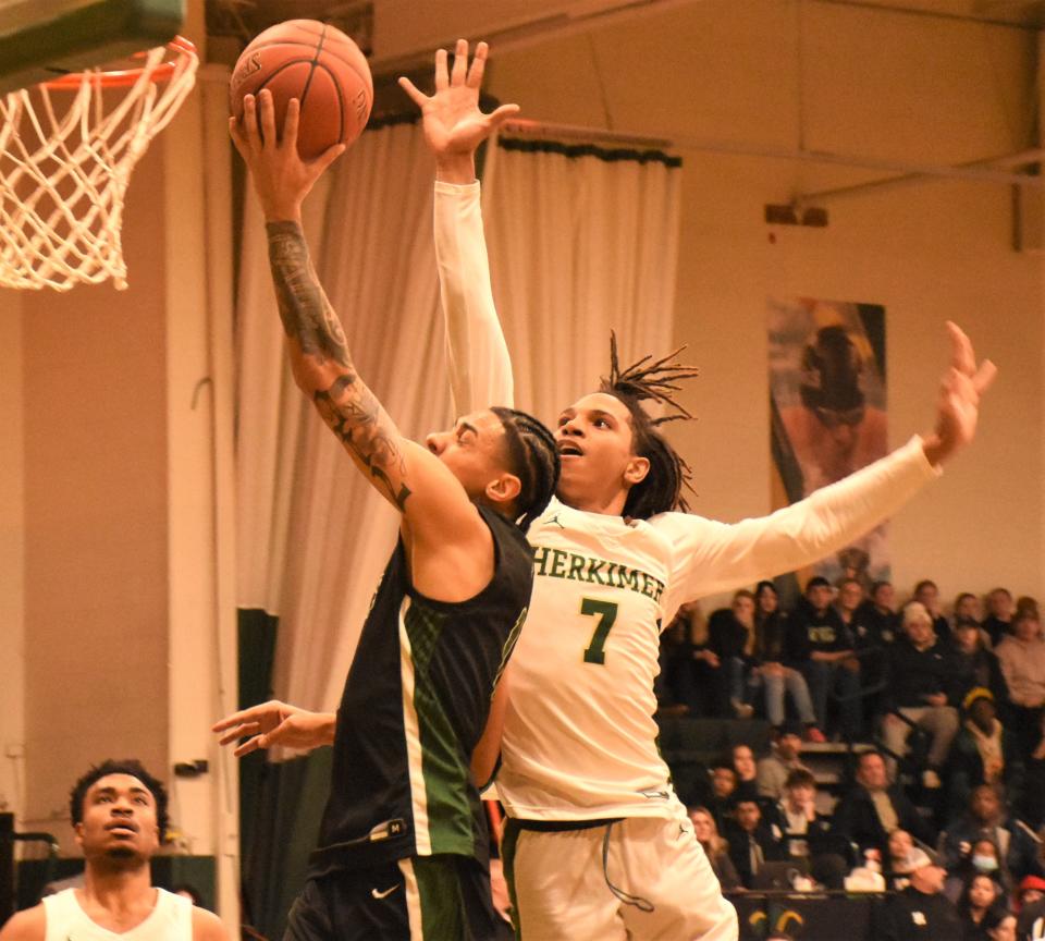 Jalen Bradberry goes up with a shot for Mohawk Valley Community College with Jayden Norris (7) coming in from behind trying to block it Sunday.
