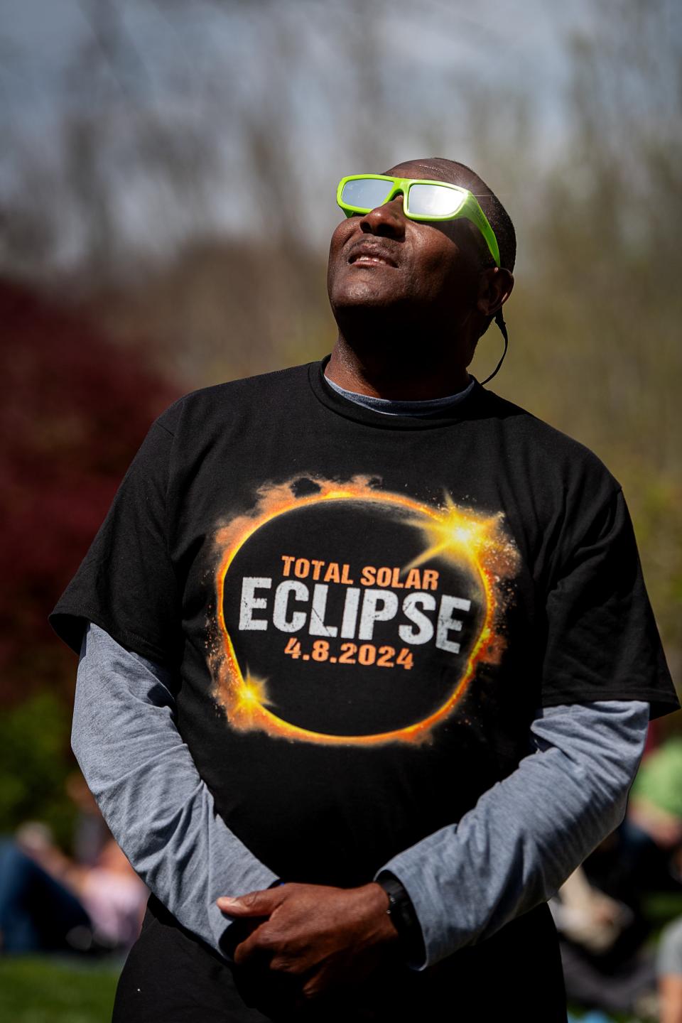 James Dixon takes in the solar eclipse, April 8, 2024. Dixon traveled from Spring Lake, near Fayetteville, to see the phenomenon in Asheville. “Maybe our grandkids will take us to the next one in 2044,” said Dixon.