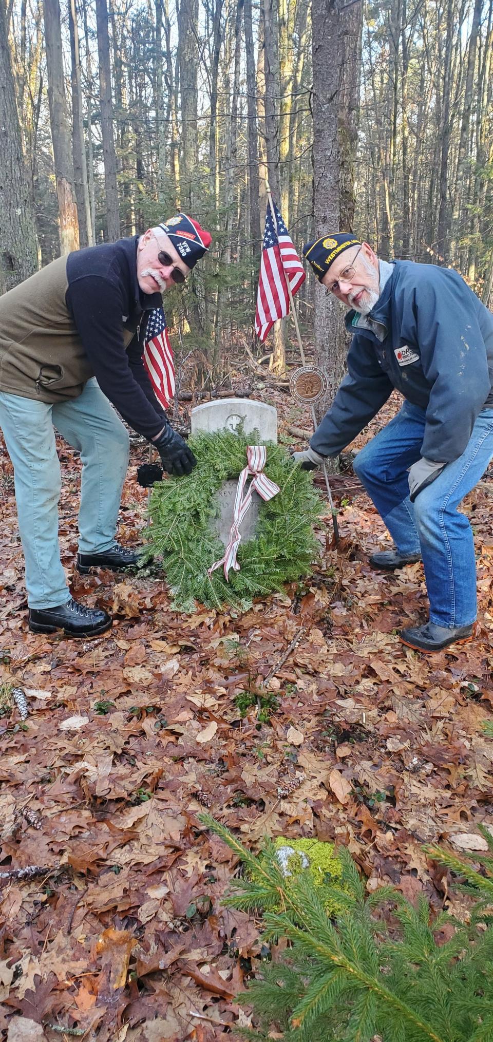 Tom Lehman, commander of the Westminster VFW, left, and Peter Lahtinen, commander of the American Legion in Westminster, place a wreath at the grave of Private Abner Miles last Christmas.