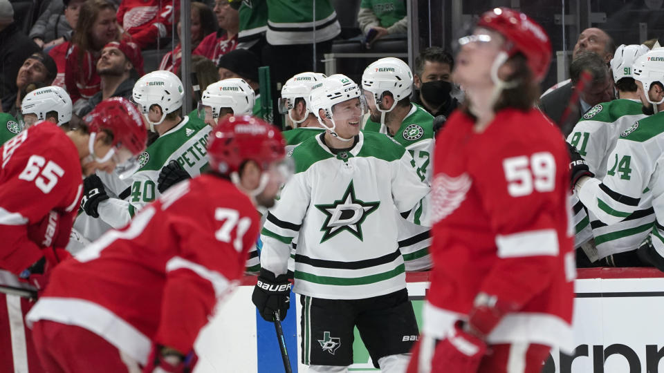 Dallas Stars defenseman Esa Lindell (23) celebrates his goal against the Detroit Red Wings in the second period of an NHL hockey game Friday, Jan. 21, 2022, in Detroit. (AP Photo/Paul Sancya)