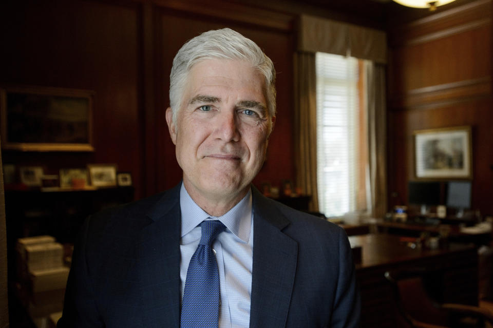 Supreme Court Justice Neil Gorsuch poses for a portrait in his office at the Supreme Court, Monday, July 29, 2024, in Washington. Gorsuch is out with a new book in which he says ordinary Americans are "getting whacked" by too many laws and regulations. "Over Ruled: The Human Toll of Too Much Law" is being published on Tuesday, Aug. 6. (AP Photo/Rod Lamkey, Jr.)