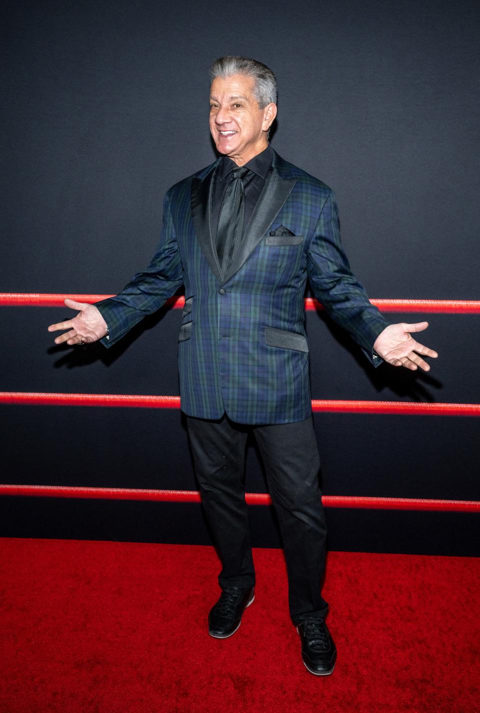 Bruce Buffer in a blue suit at "The Iron Claw" premiere