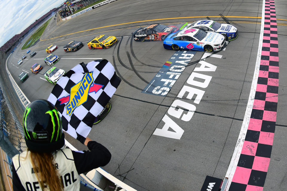 TALLADEGA, ALABAMA - OCTOBER 14: Ryan Blaney, driver of the #12 Dent Wizard Ford, takes the checkered flag ahead of Ryan Newman, driver of the #6 Wyndham Rewards Ford, to win the Monster Energy NASCAR Cup Series 1000Bulbs.com 500 at Talladega Superspeedway on October 14, 2019 in Talladega, Alabama. (Photo by Jared C. Tilton/Getty Images)