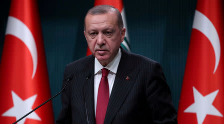 FILE PHOTO: Turkish President Tayyip Erdogan attends a news conference in Ankara, Turkey, August 14, 2018. REUTERS/Umit Bektas/File Photo