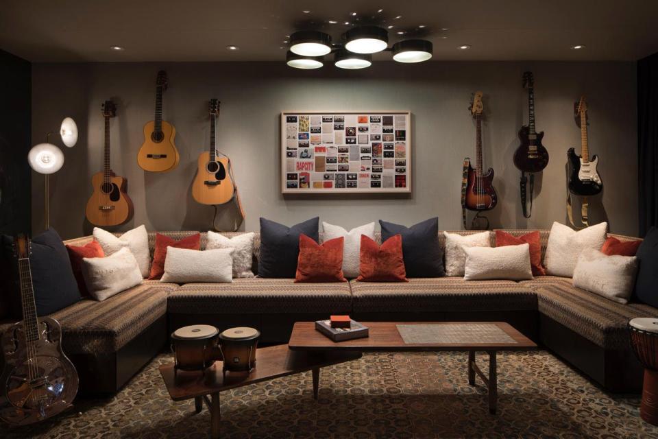 <p>If you or your kids like to rock out, and you'd rather not disturb your neighbors, a basement is the perfect place to house a music room. <a href="https://kendallwilkinson.com/" rel="nofollow noopener" target="_blank" data-ylk="slk:Kendall Wilkinson Design;elm:context_link;itc:0;sec:content-canvas" class="link ">Kendall Wilkinson Design</a> created this stylish and comfy stunner, installing soundproofing on the walls and the ceiling.</p>