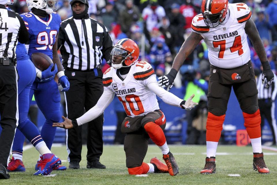 FILE - In this Dec. 18, 2016, file photo, Cleveland Browns quarterback Robert Griffin III (10) reacts after being sacked by Buffalo Bills defensive end Shaq Lawson (90) during the second half of an NFL football game, in Orchard Park, N.Y. A person familiar with the decision says the Browns are releasing quarterback Robert Griffin III after one injury-marred season. Griffin is being let go one day before he would have been due a $750,000 roster bonus, said the person who spoke Friday, March 10, 2017, to the Associated Press on condition of anonymity because the team has not announced the move. (AP Photo/Bill Wippert, File)