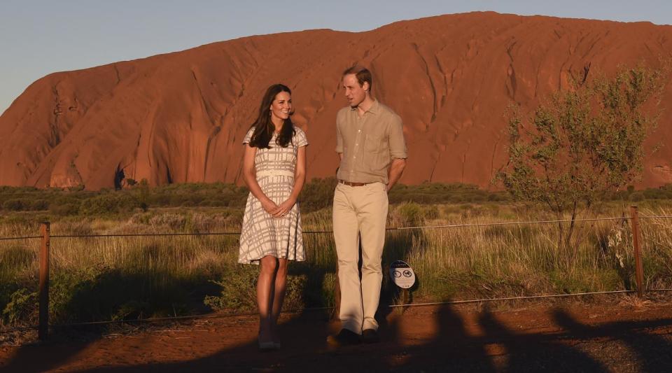 Britain's Prince William and his wife, Kate, Duchess of Cambridge, pose for a photo at sunset in Uluru, Australia, Tuesday, April 22, 2014. William and Kate have received a traditional Aboriginal welcome during a visit to the tiny town of Yulara, near the bright red sandstone monolith Uluru, also known as Ayers Rock, in the Australian Outback. (AP Photo/William West, Pool)