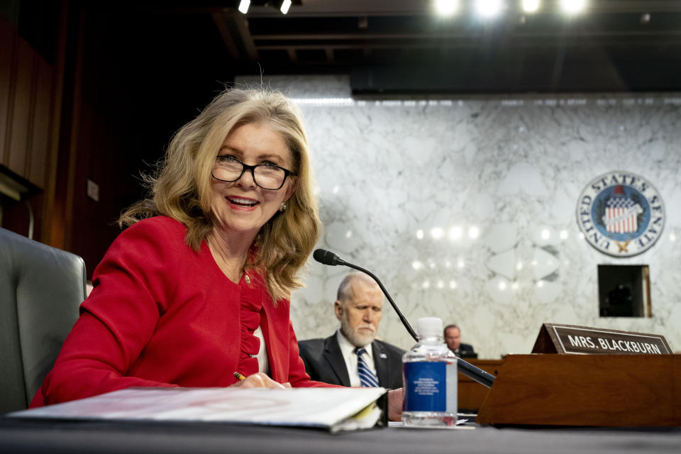 Sen. Thom Tillis, R-N.C., center, listens as Sen. Marsha Blackburn, R-Tenn., left, speaks during a Senate Judiciary Committee hearing to examine promoting competition and protecting consumers in live entertainment on Capitol Hill in Washington, Tuesday, Jan. 24, 2023. (AP Photo/Andrew Harnik)