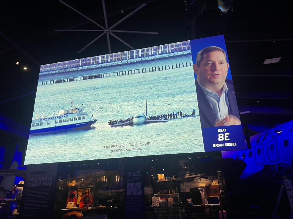 The video playing on a giant screen.