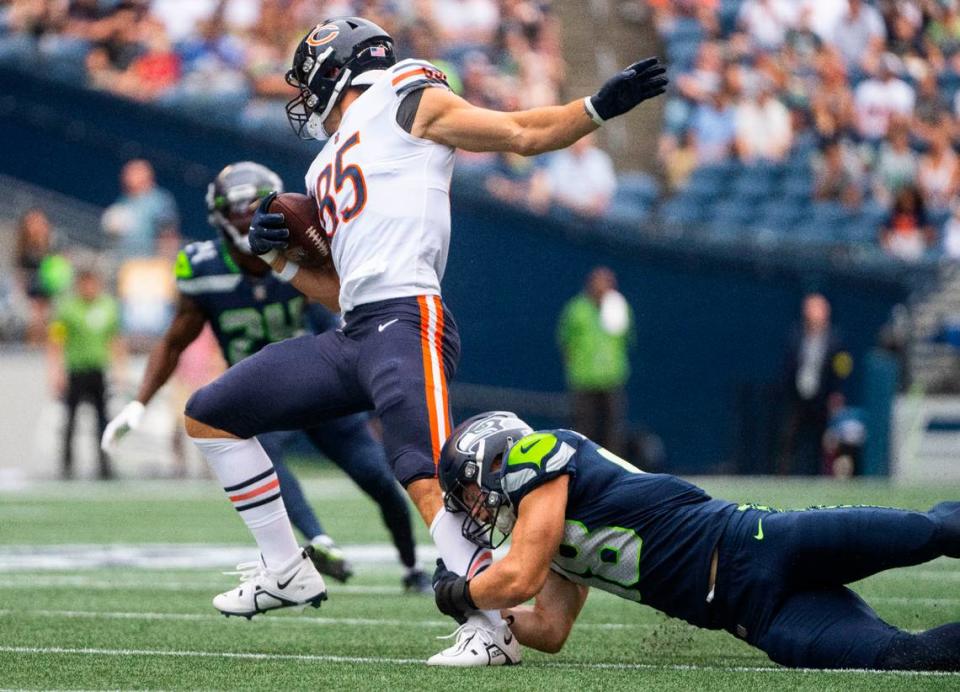 Seattle Seahawks linebacker Joel Dublanko (48) tries to tackle Chicago Bears tight end Cole Kmet (85) during the first half of the Seahawks second preseason game at Lumen Field in Seattle, Wash. on August 18, 2022. Cheyenne Boone/Cheyenne Boone/The News Tribune