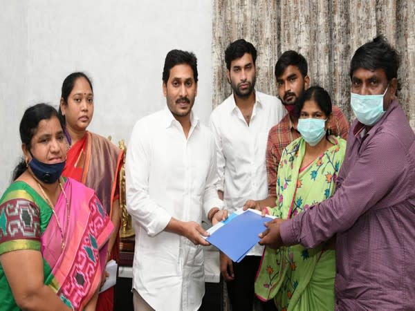 Andhra Pradesh Chief Minister YS Jagan Mohan Reddy with the family of Divya Tejaswini. 