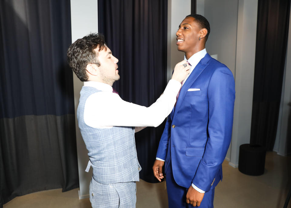 R.J. Barrett gets fit for a custom Indochino suit for the 2019 NBA Draft. - Credit: Sansho Scott/BFA.com