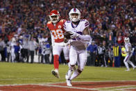 Buffalo Bills wide receiver Gabriel Davis (13) catches a 19-yard touchdown pass ahead of Kansas City Chiefs cornerback L'Jarius Sneed (38) during the second half of an NFL divisional round playoff football game, Sunday, Jan. 23, 2022, in Kansas City, Mo. (AP Photo/Ed Zurga)