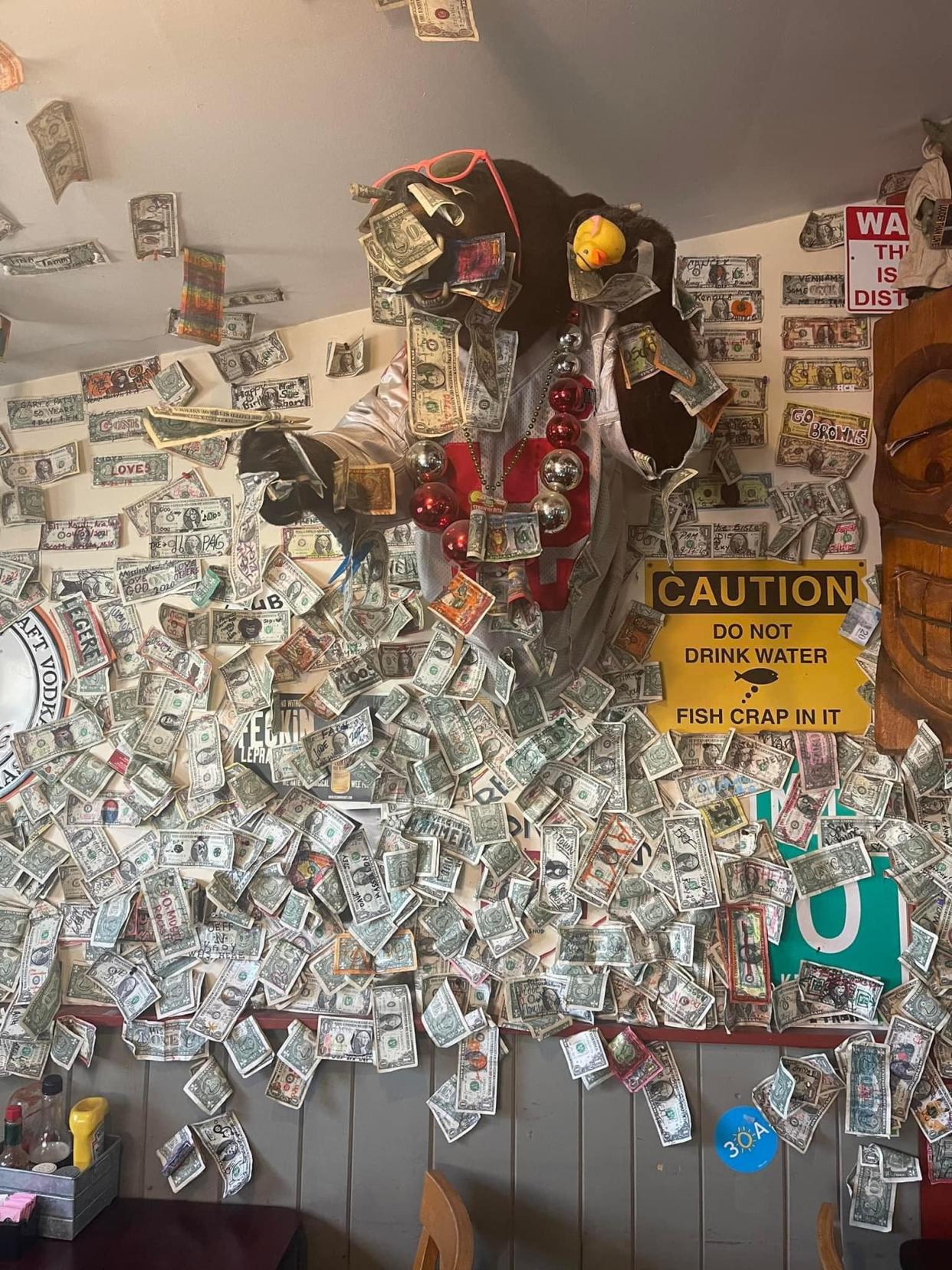 Eadies Fish House is looking for a way to clean the dollar bills accumulated on its walls over the years, so the bank will accept them.