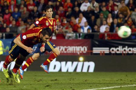 Spain's Alvaro Negredo heads the ball to score a goal against Belarus during their 2014 World Cup qualifying soccer match at Son Moix stadium in Palma de Mallorca October 11, 2013. REUTERS/Gustau Nacarino