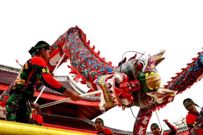 Dragon dance: The liong dancers move swiftly accompanied by the sound of drums and cymbals at Semarang's Sam Poo Kong.
