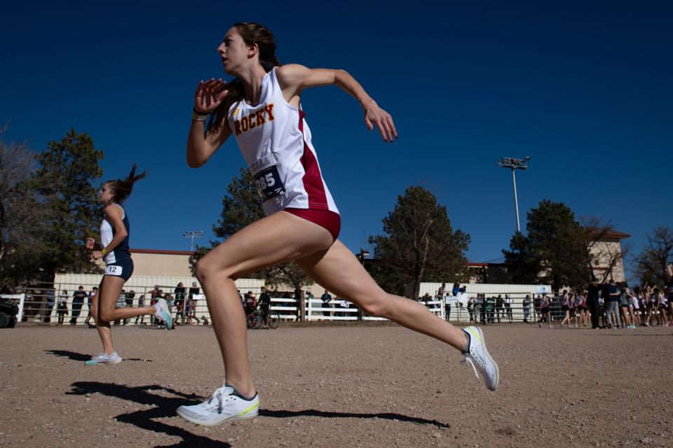 Rocky Mountain High School's Lindsey Kaines warms up before racing in the girls Class 5A cross country state finals at the Norris Penrose Event Center in Colorado Springs, Colo. on Saturday, Oct. 29, 2022.