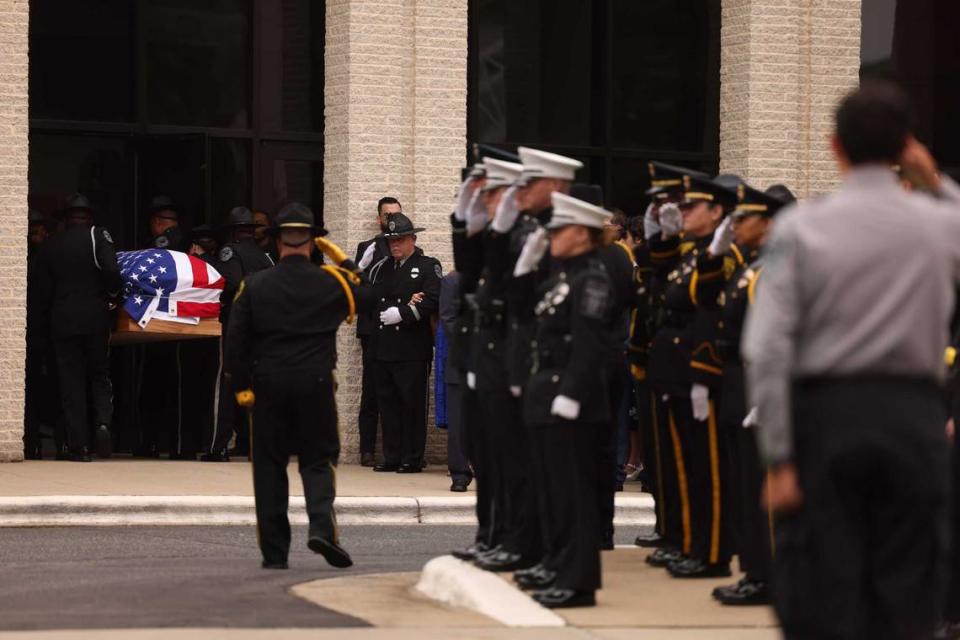 A casket of Investigator Sam Poloche of the N.C. Department of Adult Correction makes its way to First Baptist Church in Charlotte for the memorial service on Monday, May 13, 2024. Poloche killed in the line of duty while serving a warrant in east Charlotte on Monday April 29, 2024.