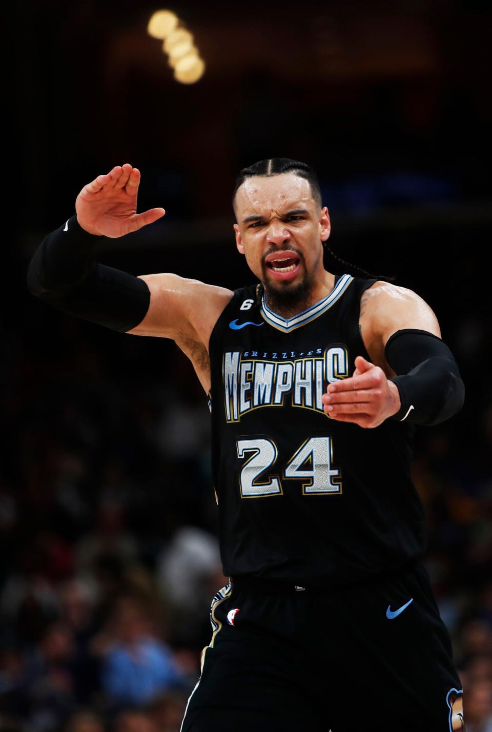 Memphis Grizzlies forward Dillon Brooks (24) reacts to his teammate Santi Aldama being pushed by Golden State Warriors forward JaMychal Green (1) during a free throw attempt  on March 9, 2023 at the Fedex Forum in Memphis.