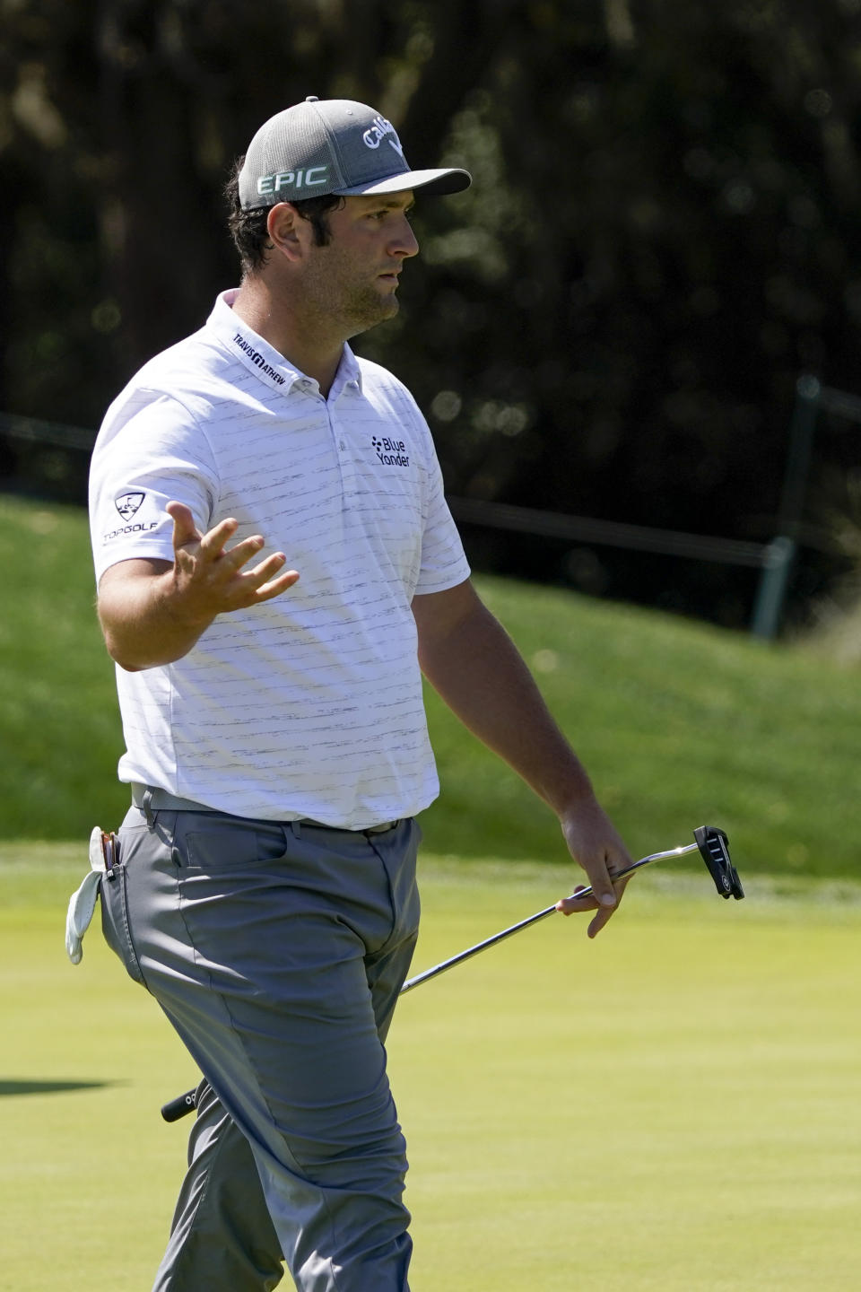 Jon Rahm, of Spain, reacts after missing a putt on the second hole during the third round of The Players Championship golf tournament Saturday, March 13, 2021, in Ponte Vedra Beach, Fla. (AP Photo/John Raoux)