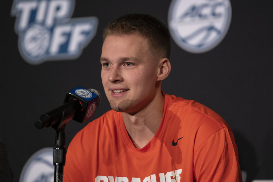 Syracuse guard Buddy Boeheim answers a question during NCAA college basketball Atlantic Coast Conference media day, Tuesday, Oct. 12, 2021, in Charlotte, N.C. (AP Photo/Matt Kelley)