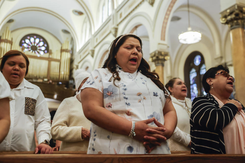 Parishioners attend Easter Mass at Sacred Heart of Jesus and Saint Patrick, Sunday, March 31, 2024, in Baltimore, Md. (AP Photo/Julia Nikhinson)
