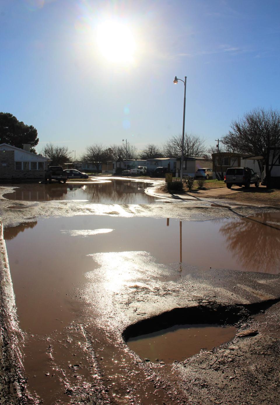 The pothole-filled entrance to Westgate Mobile Home Park in west Abilene is under water last week after a rainfall. Not only does that affect residents, it discourages those making deliveries - such as Meals on Wheels volunteers - from entering. The issue has been taken to the city of Abilene, which is seeking a remedy. This is not a city street. Feb 28 2023