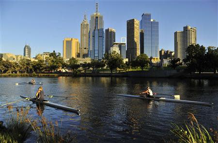 Rowers train at dawn on Melbourne's Yarra River in this January 24, 2012 file photo. REUTERS/Toby Melville/Files