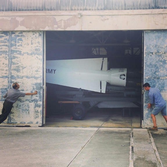 Everglades National Park Superintendent Pedro Ramos opens the hangar doors to the Nike Missile Site at the Everglades