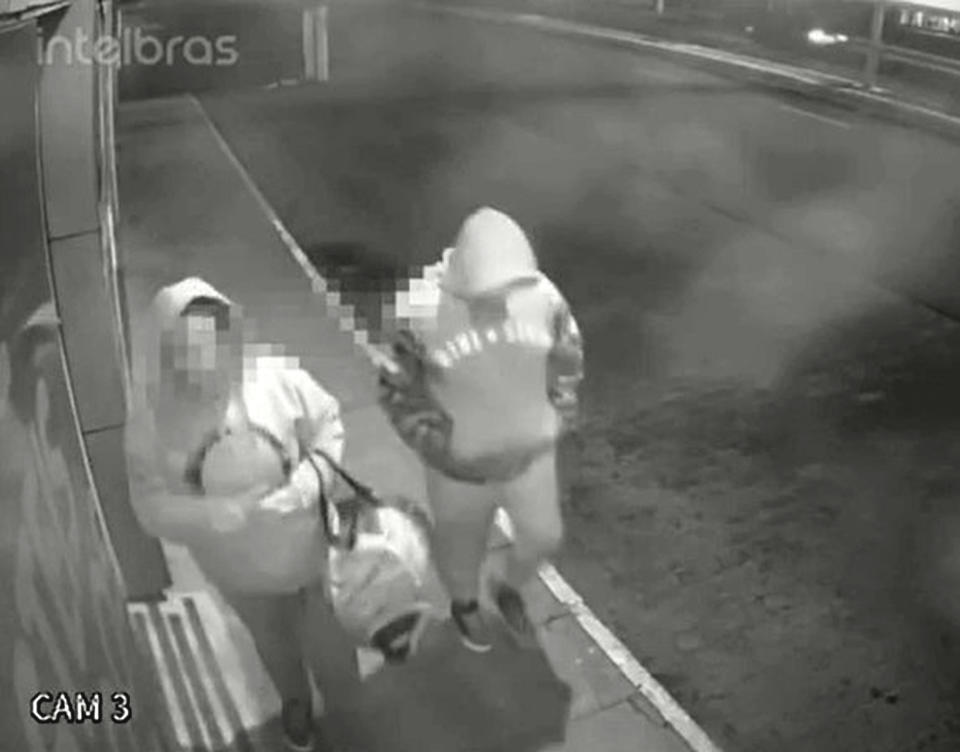 CCTV shows the mother of Miguel Rodrigues dos Santos with her lover, with a duffle bag in the streets of Imbe. Source: Newsflash/Australscope