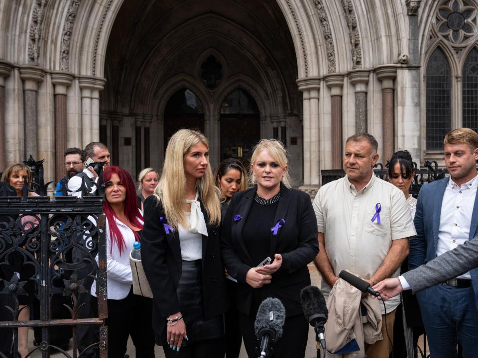 Hollie Dance stands with her ex-partner, Paul Battersbee, and other members of the family outside the Royal Courts of Justice in London, England.