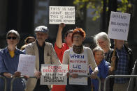 Pro-democracy demonstrators protest outside the Supreme Court in London, Thursday, Sept. 19, 2019. The Supreme Court is set to decide whether Prime Minister Boris Johnson broke the law when he suspended Parliament on Sept. 9, sending lawmakers home until Oct. 14 — just over two weeks before the U.K. is due to leave the European Union. (AP Photo/Matt Dunham)