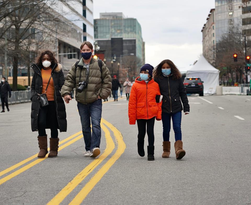 Anna Havlin, 10, right, and her family came to Washington from Brazil for the inauguration of President-elect Joe Biden. The nation's capital is on high alert against threats after a deadly pro-Donald Trump insurrection at the U.S. Capitol.