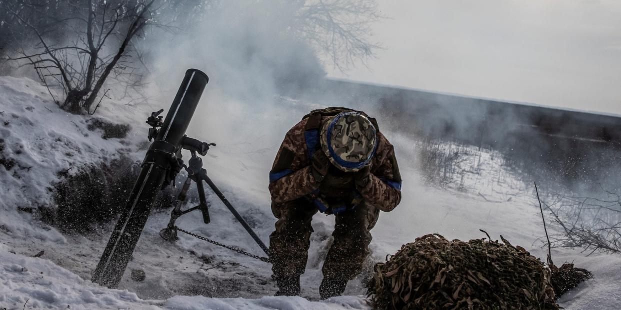 A Ukrainian service member fires a mortar towards Russian troops in frontline near the Vuhledar town, amid Russia's attack on Ukraine, in Donetsk region, Ukraine February 7, 2023