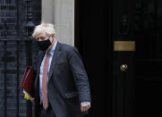 Britain's Prime Minister Boris Johnson leaves 10 Downing Street for the House of Commons to attend his weekly Prime Minister's Questions in London, Wednesday, Sept. 30, 2020. (AP Photo/Alastair Grant)