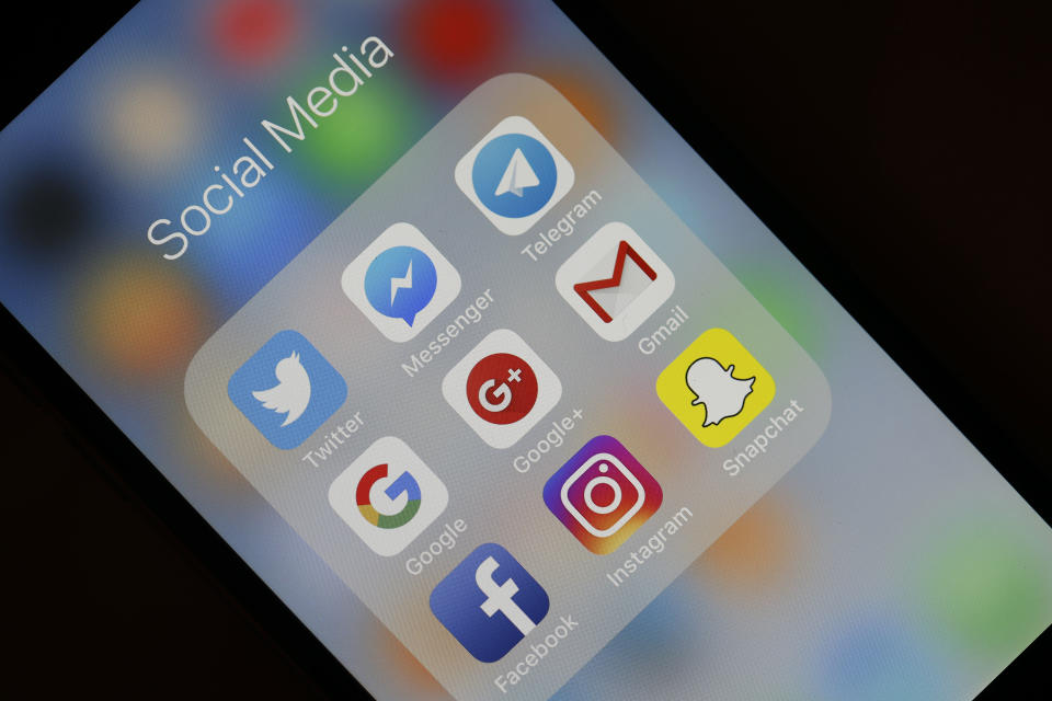 Twitter, Messenger, Telegram, Google, Google+, Gmail, Facebook, Instagram and Snapchat are displayed on the screen of an Apple iPhone. Photo: Chesnot for Getty Images